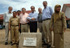 El ministro de Defensa, José Bono, junto a su delegación y las autoridades de la zona, posan ante una placa dedicada a España, en agradecimiento a la ayuda recibida por los militares durante su estancia en la zona