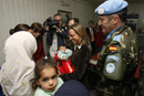 Carme Chacón, ministra de Defensa coge en sus brazos a Salah Rajab, la niña libanesa de 9 meses operada por medicos militares españoles en la Base Cervantes en Líbano