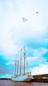The Blue Angels flying over the Spanish Training Ship “Juan Sebastian de Elcano”