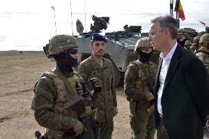 NATO's Secretary General, Jens Stoltenberg, chats with exercise participants