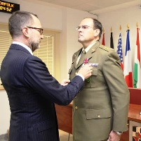 Ambassador Costos lays the Legion of Merit to Colonel San Antonio