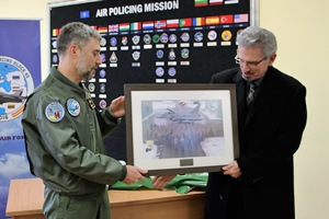 The Spanish Air Force detachment commander presents a memento to an AWC instructor